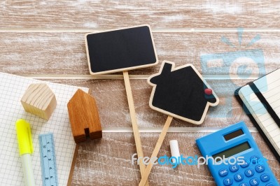 House For Sale Sign With Calculator Stock Photo