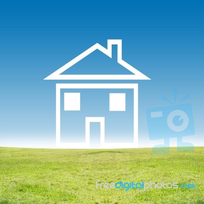 House Icon On Green Field Stock Photo