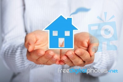 House In Hands Stock Photo