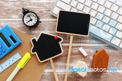 House Sale And Rent Sign On Working Desk Stock Photo