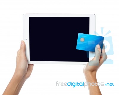 Human Hands Holding Tablet Pc And Credit Card Stock Photo