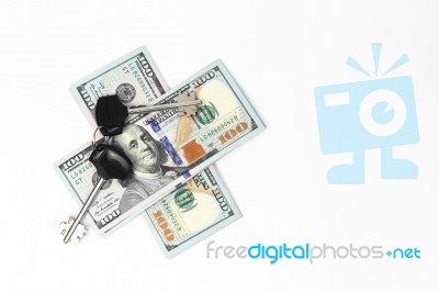 Hundred-dollar Bills Under The Keys Stock Photo