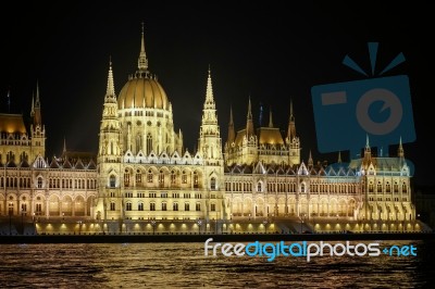 Hungarian Parliament Building Illuminated At Night In Budapest Stock Photo