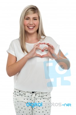 I Am In Love. Girl Making Heart With Fingers Stock Photo