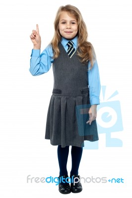 I Know The Answer. School Girl Raising Hand Stock Photo