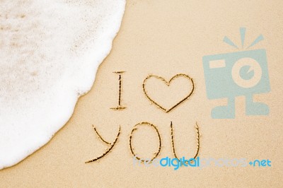 I Love You Written On Wet Yellow Beach Sand Stock Photo