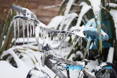 Ice Covered Frozen Bicycle Stock Photo