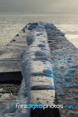 Ice-covered Pier Early In A Morning Stock Photo