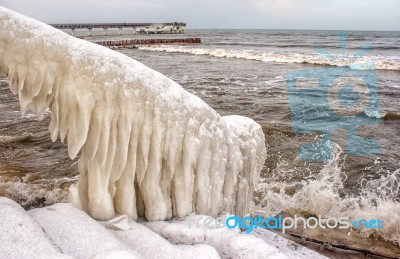 Ice Covered Staircase On The Beach Stock Photo