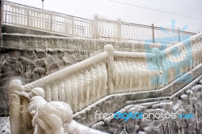 Ice Covered Staircase On The Beach Stock Photo