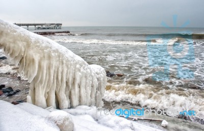 Ice Covered Staircase On The Beach Stock Photo