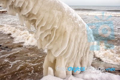 Ice Covered Staircase On The Beach Stock Photo