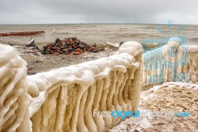 Ice Covered Staircase On The Beach Stock Photo