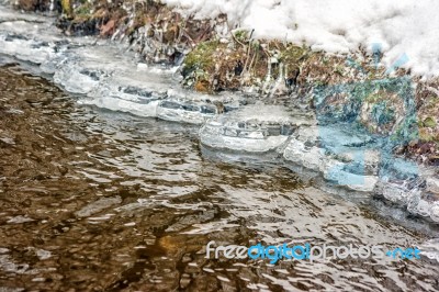 Ice On The Bank Of The Creek Stock Photo