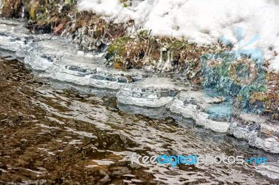 Ice On The Bank Of The Creek Stock Photo