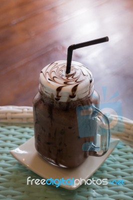 Iced Chocolate On Glass Table Top Stock Photo