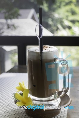 Iced Coffee Latte On Balcony Wooden Table Stock Photo