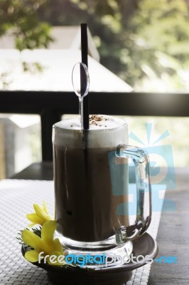 Iced Coffee Latte On Balcony Wooden Table Stock Photo