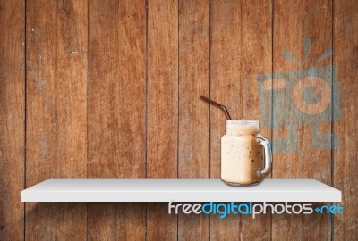 Iced Coffee On Shelf On Old Wooden Background Stock Photo