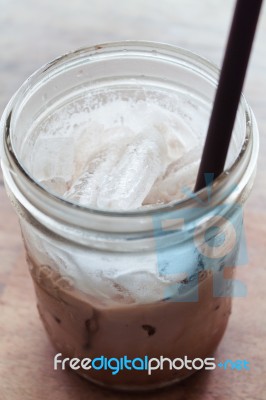 Iced Coffee On Wooden Table Stock Photo