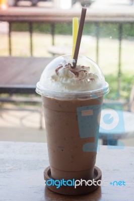 Iced Coffee On Wooden Table Stock Photo