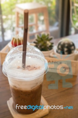 Iced Coffee On Wooden Table Stock Photo