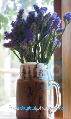 Iced Coffee On Wooden Table Top Stock Photo