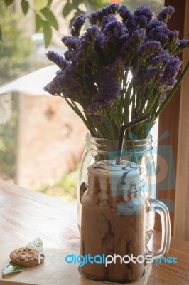 Iced Coffee On Wooden Table Top Stock Photo