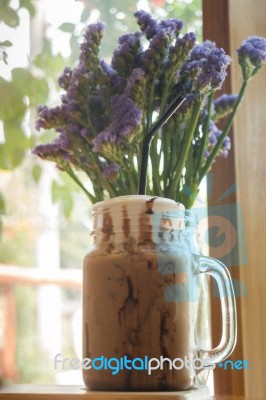 Iced Coffee On Wooden Table Top Stock Photo