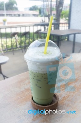 Iced Glass Of Green Tea Latte Stock Photo