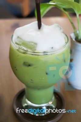 Iced Green Tea Latte With Milk Foam Stock Photo