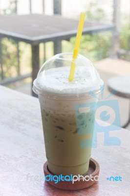 Iced Green Tea On Wooden Table Stock Photo