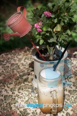 Iced Milk Coffee On Outdoor Table Stock Photo