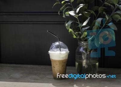 Iced Milk Coffee On Sunshine Wooden Table Stock Photo