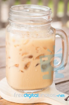 Iced Milk Coffee On Wooden Table Stock Photo