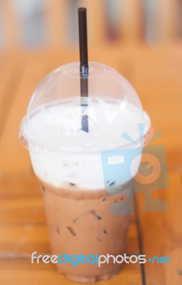 Iced Mocha Coffee In Glass On The Table Stock Photo