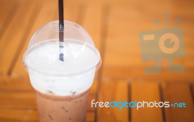 Iced Mocha Coffee In Glass On The Table Stock Photo