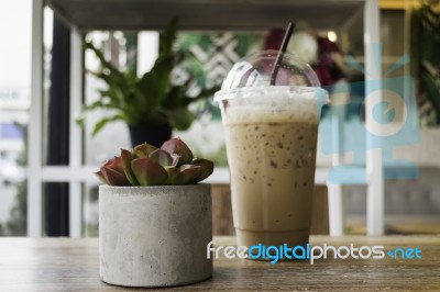 Iced Mocha Coffee On Wooden Table Stock Photo