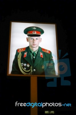 Illuminated Photograph Of A Soviet Soldier At Checkpoint Charlie… Stock Photo