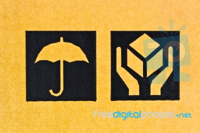 Image Close-up Of Grunge Black Fragile Symbol On Cardboard Stock Photo