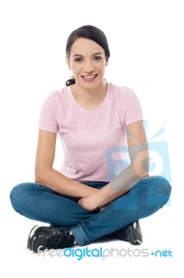 Image Of A Woman Sitting On Floor Stock Photo