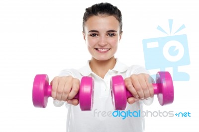 Image Of Young Girl Posing With Dumbbells Stock Photo