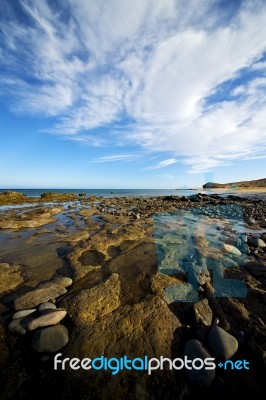 In Lanzarote Spain  Rock Stone Sky Cloud Beach Stock Photo