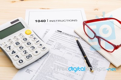 Income Tax Income Return Form With Pen And Calculator Stock Photo