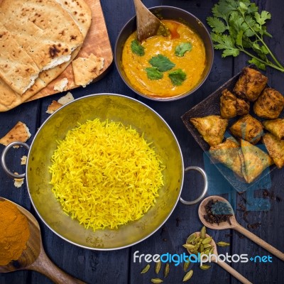 Indian Pilau Rice In Balti Dish Served With Chicken Tikka Masala… Stock Photo