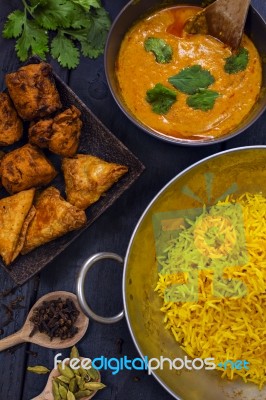 Indian Pilau Rice In Balti Dish Served With Chicken Tikka Masala… Stock Photo