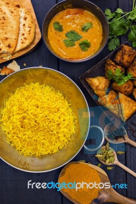 Indian Pilau Rice In Balti Dish Served With Chicken Tikka Masala… Stock Photo