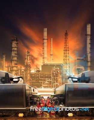 Industrial Trains And Railways Against Heavy Petrochemical Indus… Stock Photo