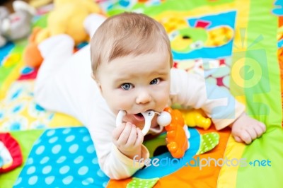 Infant Boy On Playmat Stock Photo