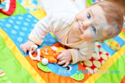 Infant Boy On Playmat Stock Photo